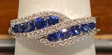 Lady's 14K white gold sapphire & diamond ring, by-pass style...
